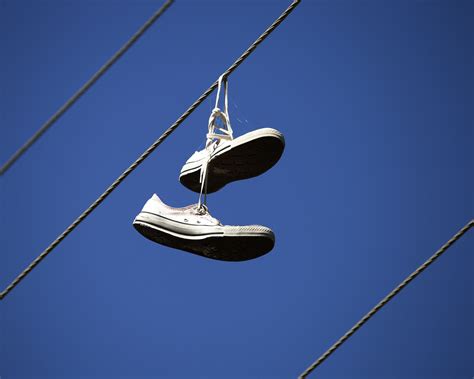 shoes on power lines meaning.